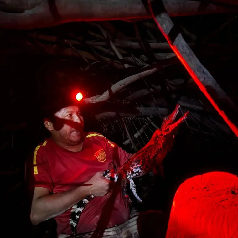 Red headlamp light on the night river
